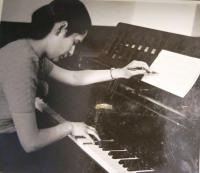 Eva Tauss (Chava Drachmann-Doron) playing the piano. 1950s 